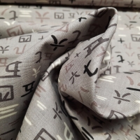 Patchworkstoff Schriftzeichen